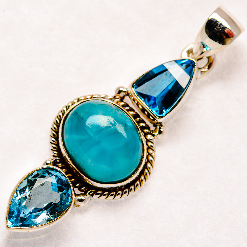 Sterling silver pendant with oval turquoise larimar and blue topaz teardrop and marquise