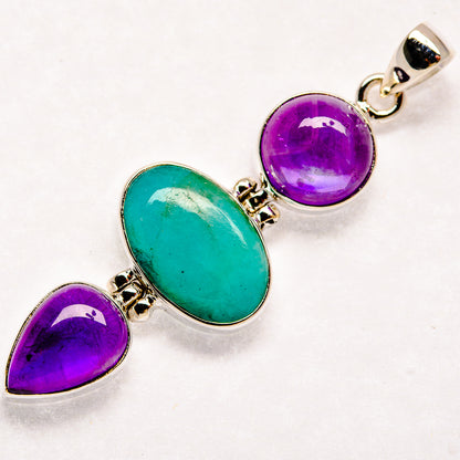 Sterling silver pendant with green larimar oval, purple amethyst round and teardrop