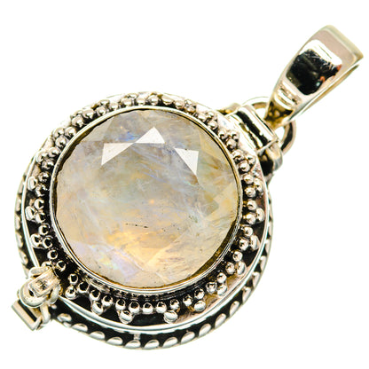 Round moonstone pendant in sterling silver with decorative border and clasp bail