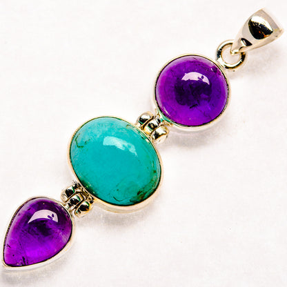 Sterling silver pendant with three settings: two purple amethyst and one blue-green larimar oval.