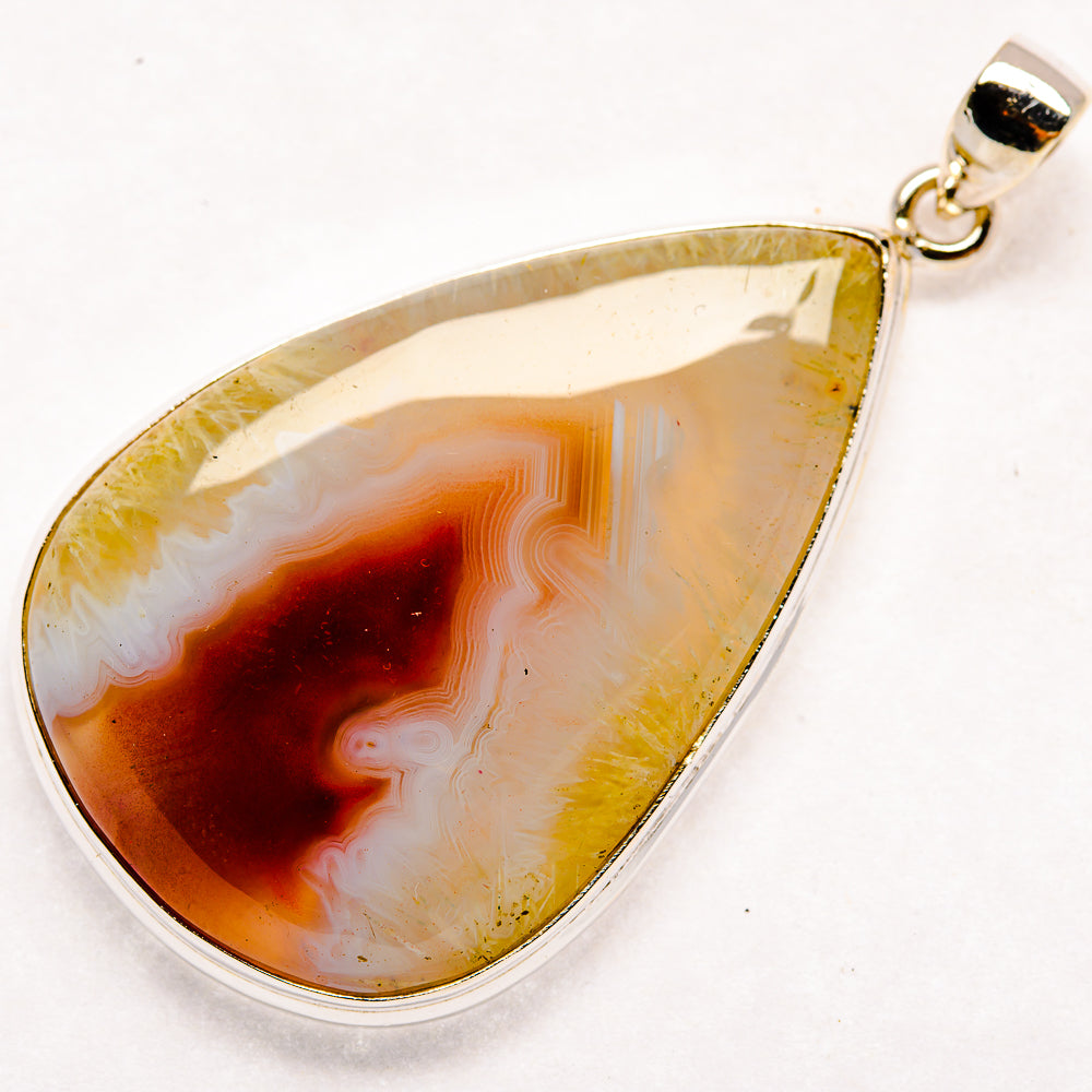Ocean jasper teardrop pendant in 925 sterling silver, white and amber banded stone