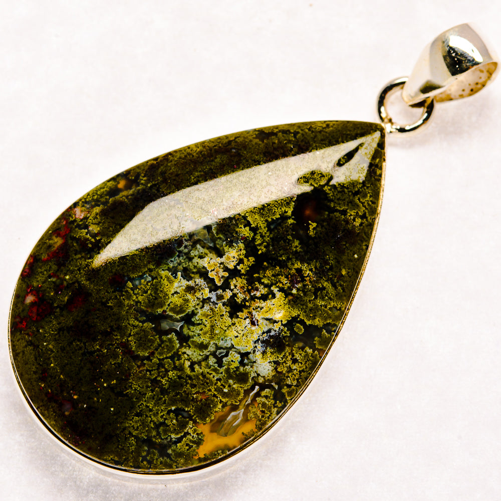 Plume agate pendant, teardrop cabochon with green mossy pattern and silver bail