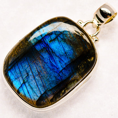 Labradorite oval pendant with vivid blue flash in sterling silver bezel and bail