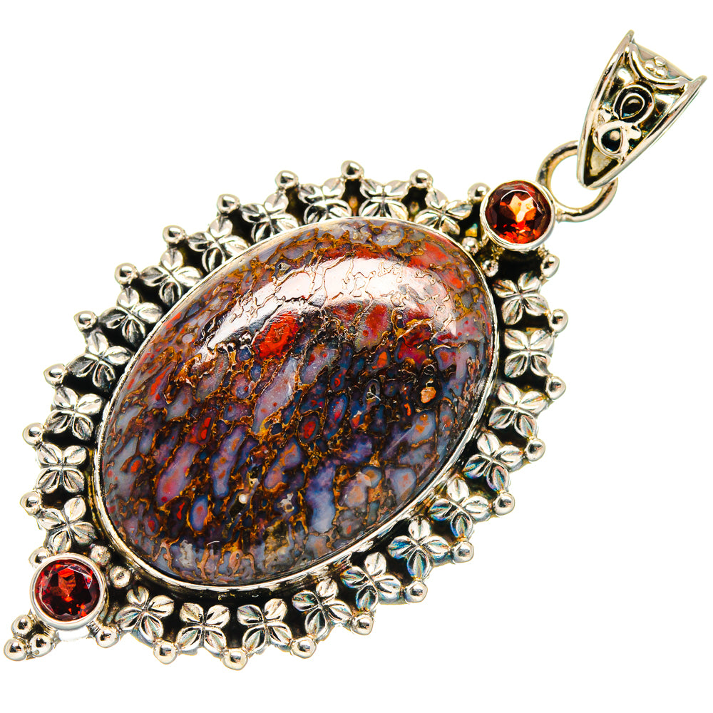 Oval dinosaur-bone style pendant in 925 sterling silver with red garnet stones and ornate border