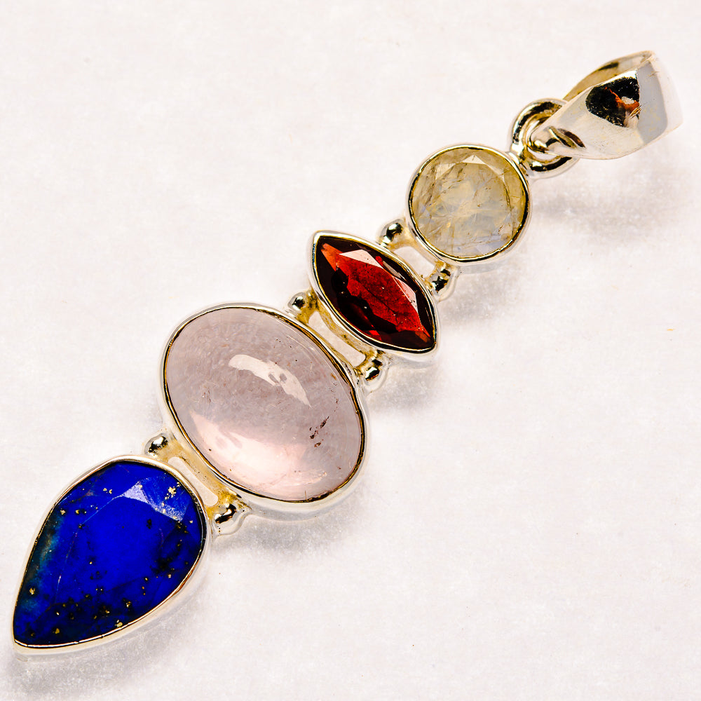 925 sterling silver pendant with blue lapis, pink moonstone, and red garnet stones