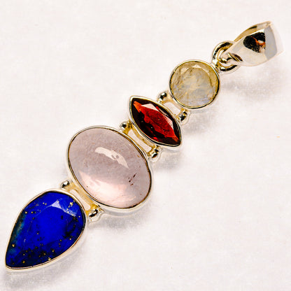 925 sterling silver pendant with blue lapis, pink moonstone, and red garnet stones