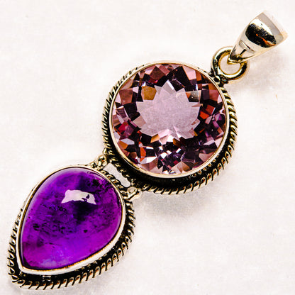 Sterling silver pendant with faceted round pink gemstone, purple teardrop, ornate bezel