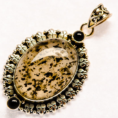 Plume agate oval cabochon pendant, ornate silver border with black onyx drops