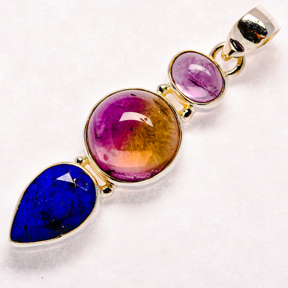 Sterling silver gemstone pendant with blue lapis, purple, and amber round stones