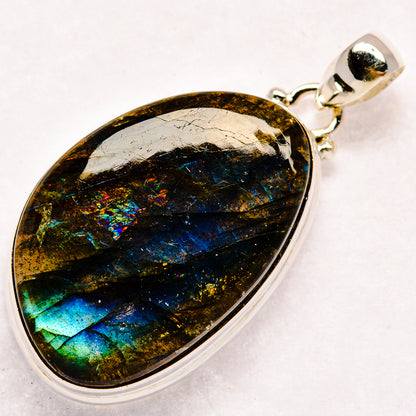 Labradorite gemstone teardrop pendant in sterling silver setting with bail