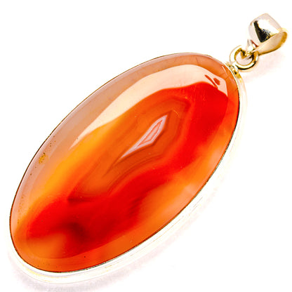 Large oval orange agate pendant with 925 sterling silver bail and bezel setting.