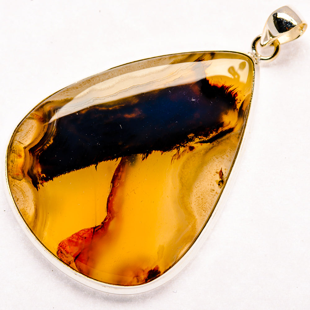 Sterling silver teardrop agate pendant with amber and dark blue bands