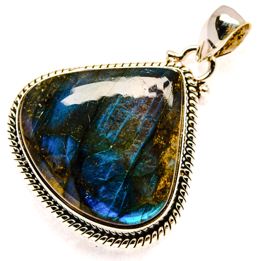 Labradorite teardrop pendant in sterling silver with ornate rope bezel and bail