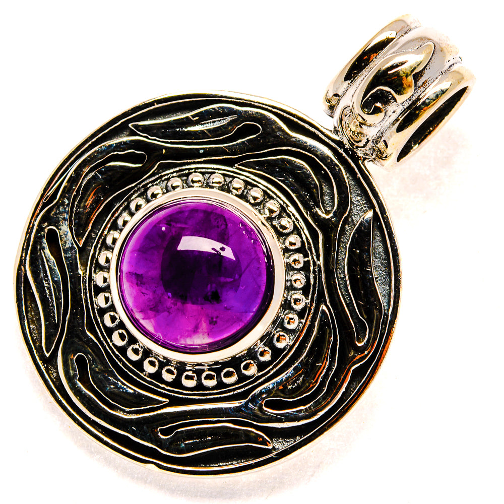 Round amethyst pendant with engraved blackened silver border, purple gemstone, and hanging bail