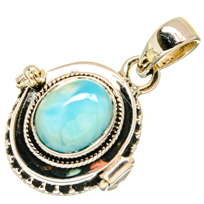 Sterling silver larimar pendant with oval blue-green cabochon and ornate rope bezel, bail top