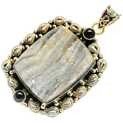 Gold-tone ornate pendant with gray druzy center and black onyx accents on silver setting