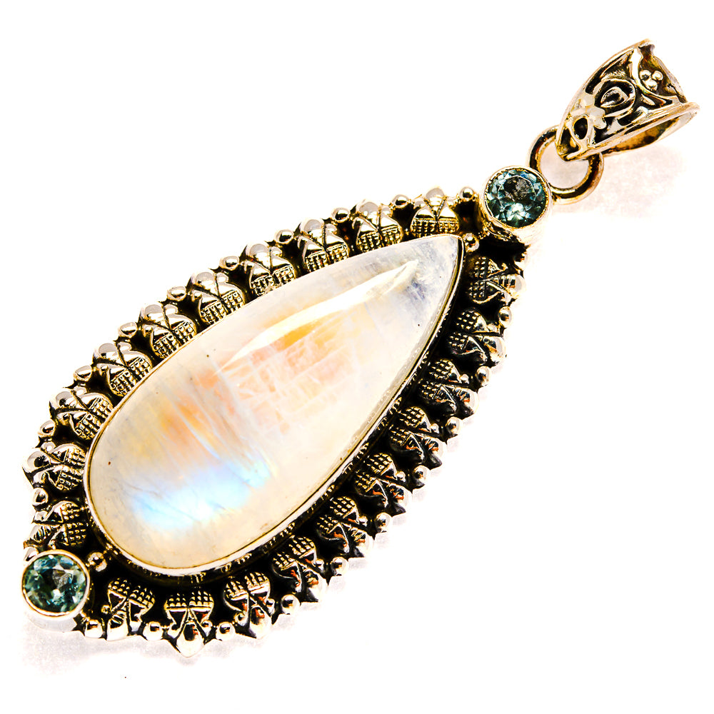 Gold-tone teardrop moonstone pendant with filigree border, blue gemstones, and loop bail