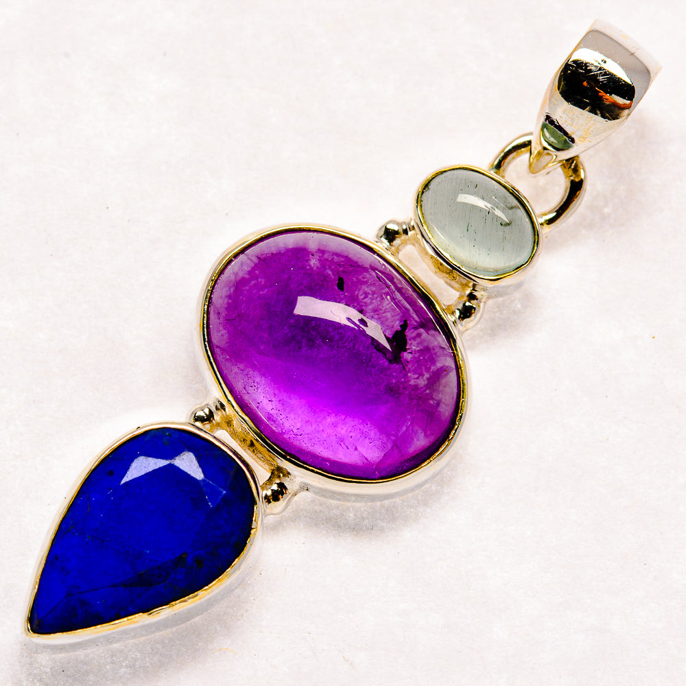 Oval amethyst, blue lapis, and light aquamarine gemstone pendant in silver bezel links