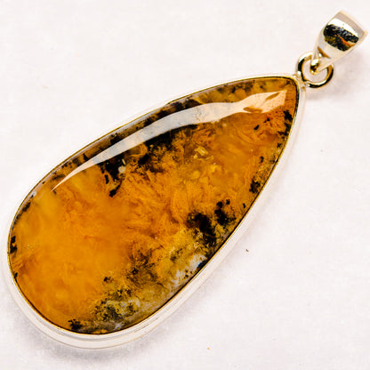 Teardrop amber plume agate pendant in polished 925 sterling silver bezel
