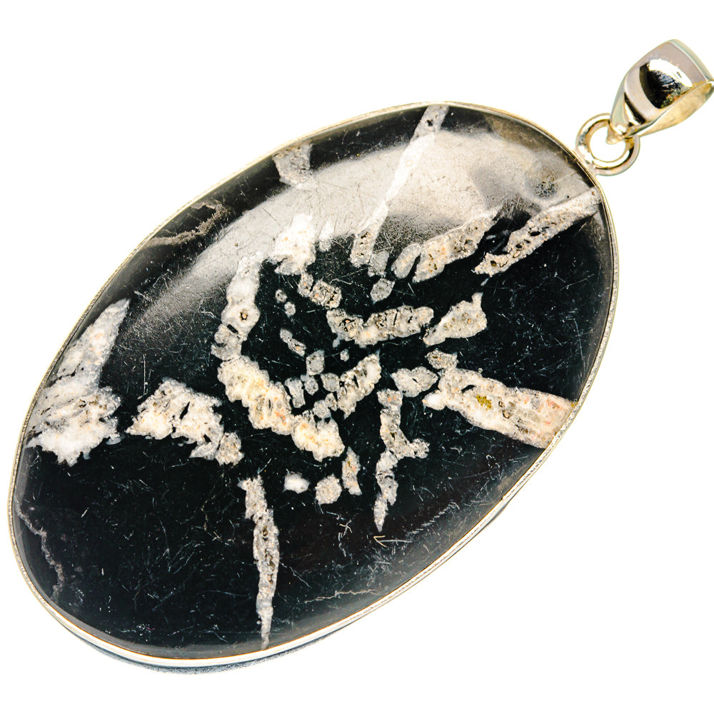 Sterling silver teardrop pendant with black stone, white chrysanthemum pattern, top loop
