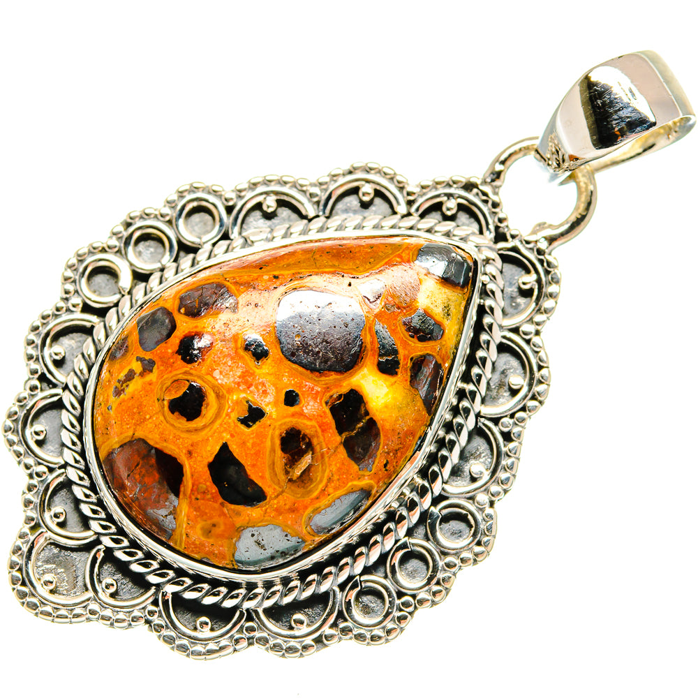 925 sterling silver pendant with ornate edge, orange bauxite stone, and top bail loop