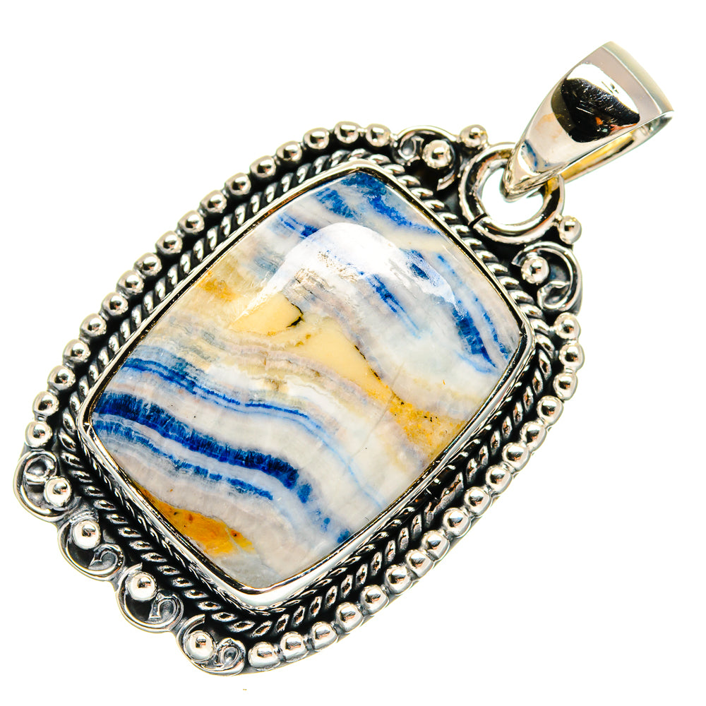 Blue scheelite gemstone pendant, silver ornate bezel and frame with top bail