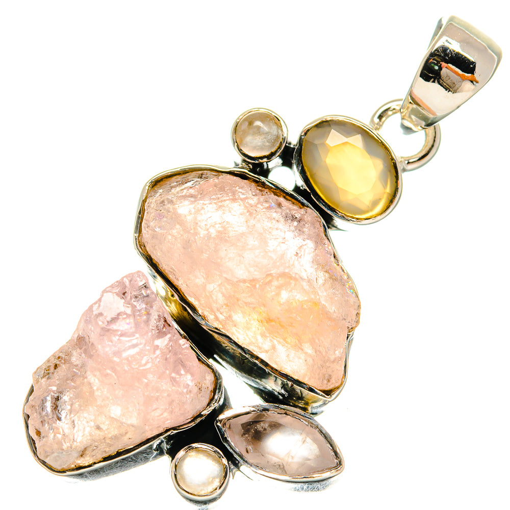 Rough rose quartz pendant with 925 sterling silver bezel settings and mixed faceted stones