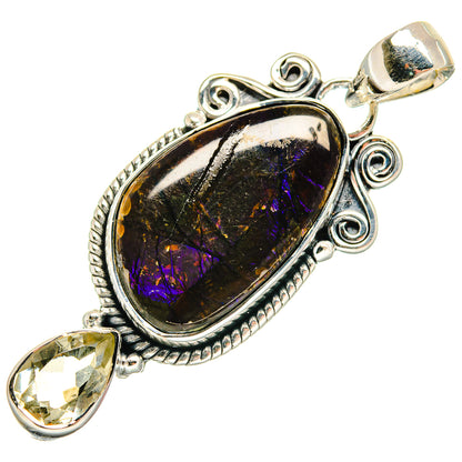 Sterling silver pendant with oval black gemstone, purple shimmer, and teardrop yellow side stone