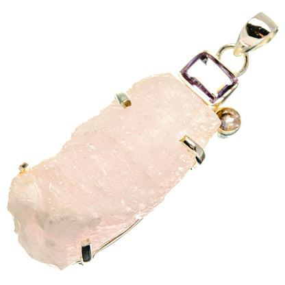 Rough light pink quartz pendant with silver bezel and purple accent stones
