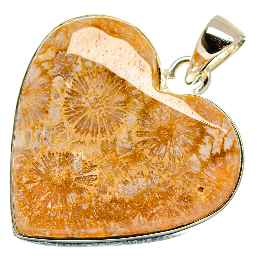 Heart-shaped fossil coral pendant in 925 sterling silver bezel, orange center