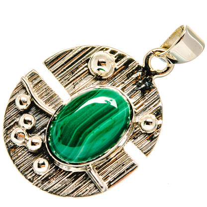 Green malachite oval pendant with ridged silver frame, small stone accents, and hook bail