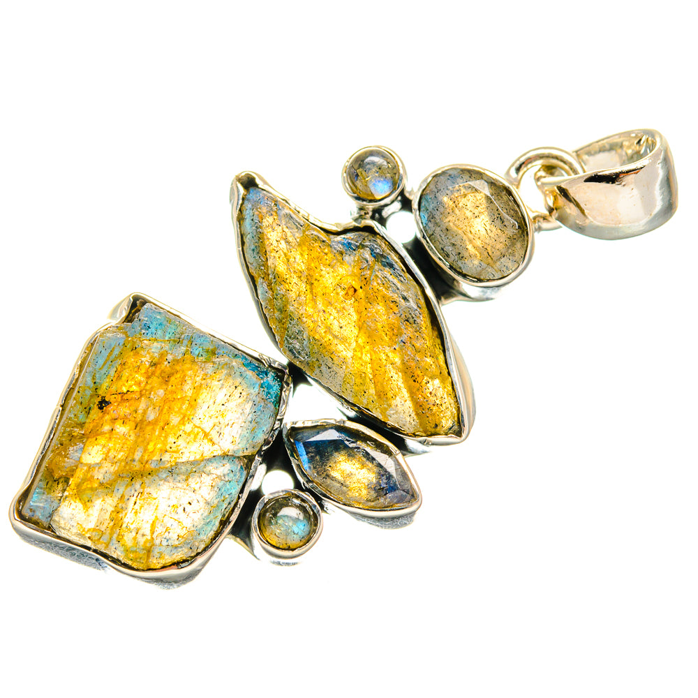 Rough labradorite pendant with mixed blue, yellow, and dark stones in silver