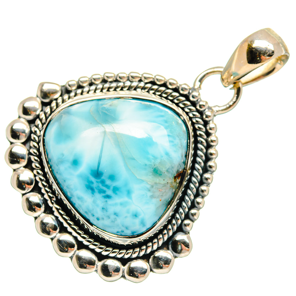 Sterling silver Larimar pendant with bright blue oval cabochon, textured bezel and bail