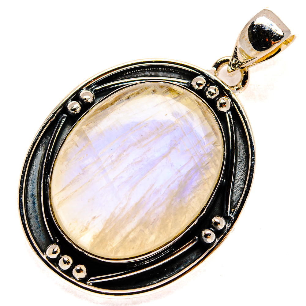 Oval rainbow moonstone pendant with black frame, gold-toned bail and pin accents