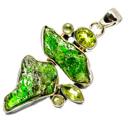 Sterling silver pendant featuring rough green diopside with peridot-green round and oval stones