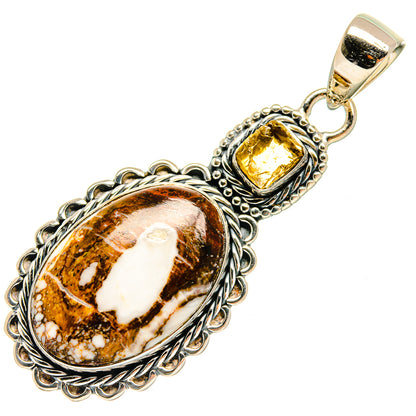 Oval brown and amber jasper pendant with decorative silver setting and loop bail