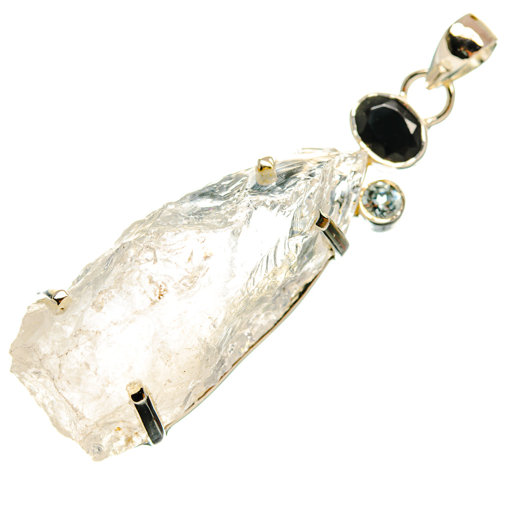 Rough moonstone pendant with black onyx and round blue stone set in sterling silver
