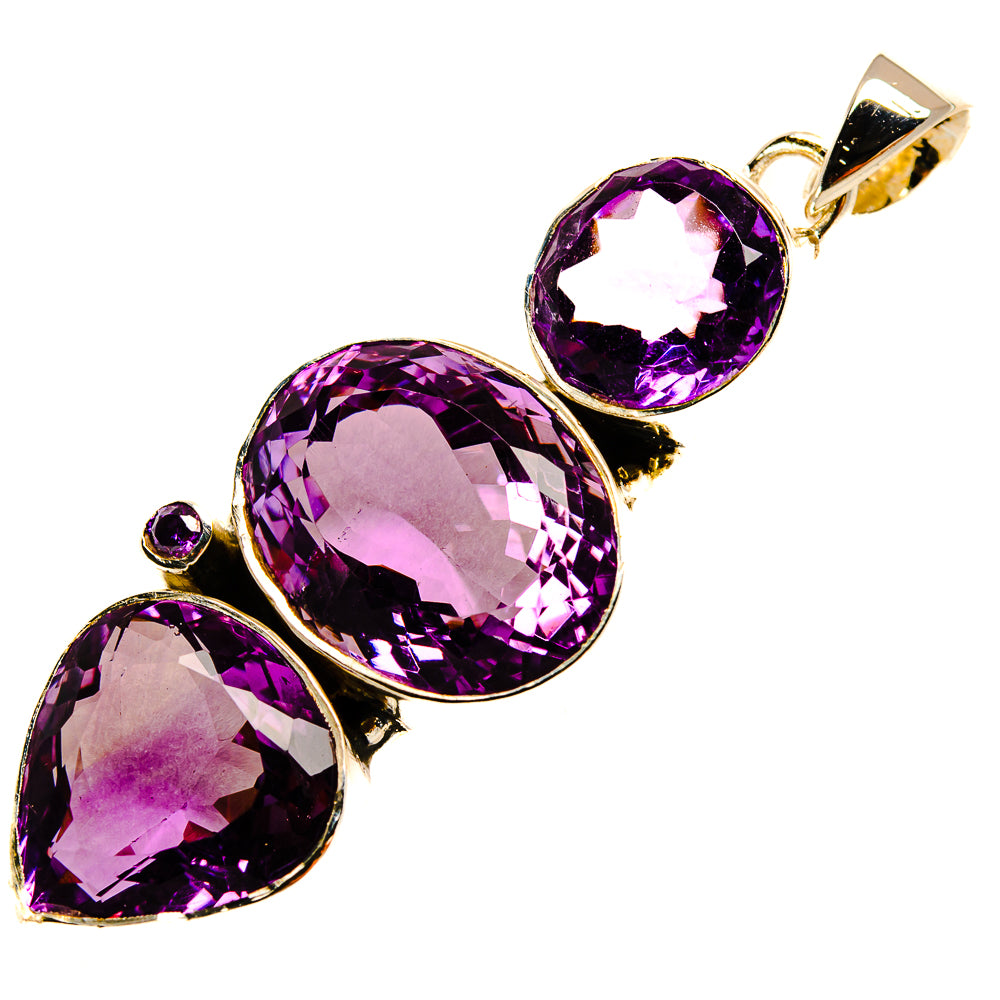 Faceted amethyst pendant with three purple gemstones and a silver bail