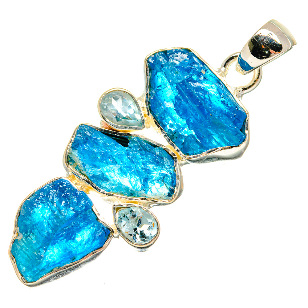 Rough blue topaz pendant with multiple faceted stones, clear round accents, silver bail.