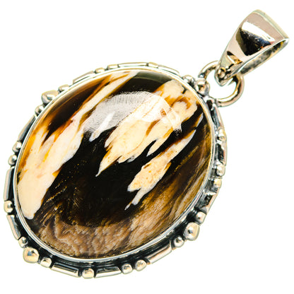 Oval jasper pendant with sterling silver rim, black-and-tan pattern, and hanging bail.