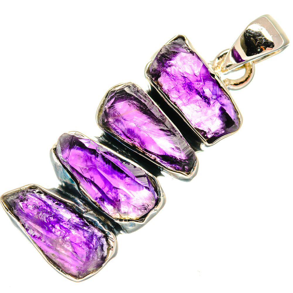 Rough amethyst pendant with three purple faceted stones in sterling silver setting