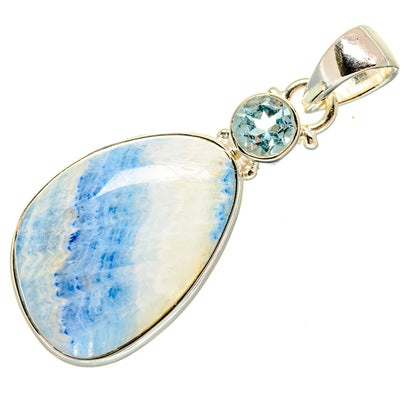 Oval blue gemstone pendant with round blue faceted stone in sterling silver bezel