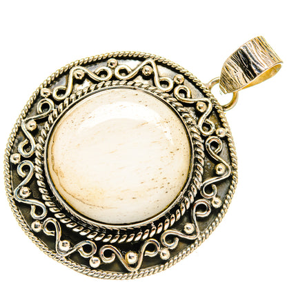 Round 925 sterling silver pendant with ornate filigree border and pale scolecite stone