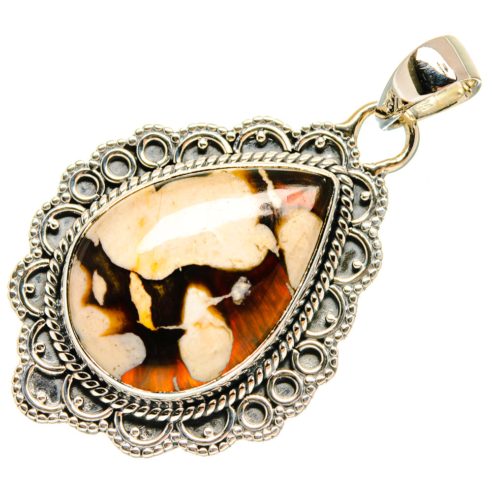 Oval jasper pendant in ornate silver setting with gold bail, cream, black, and amber pattern
