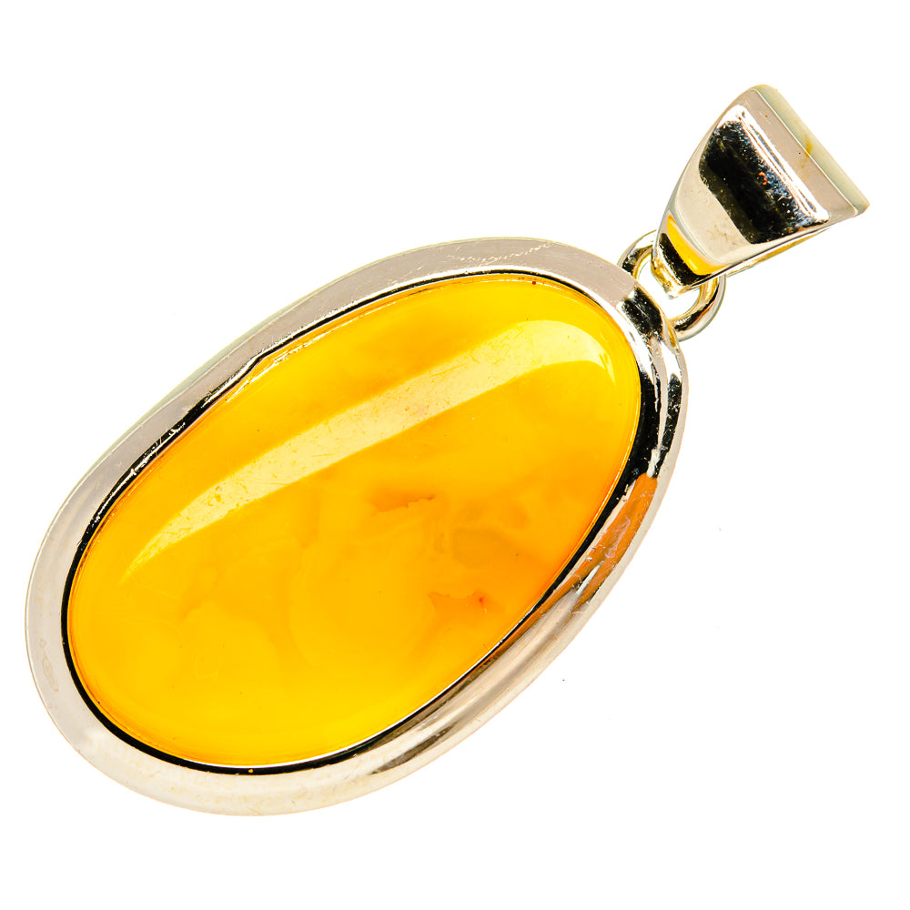 Oval amber pendant with silver-tone setting and bail, polished yellow stone