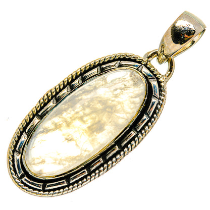Oval moonstone pendant with ornate silver bezel and silver bail, cream iridescent stone