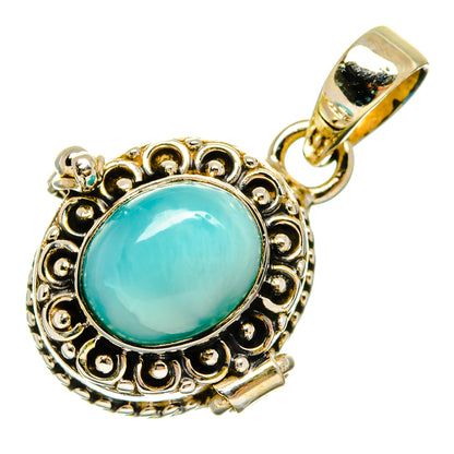 Larimar pendant with round turquoise stone in ornate silver-tone filigree bezel