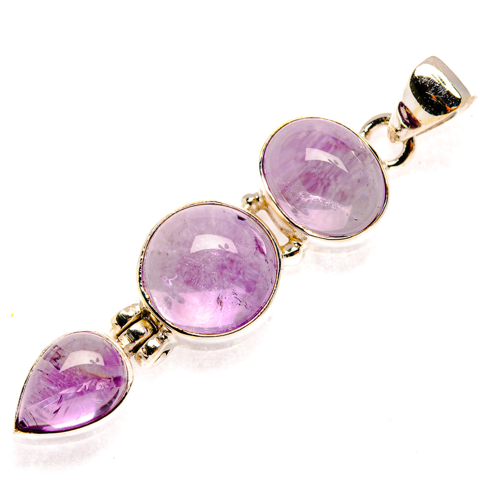 Sterling silver amethyst pendant with three round bezel-set stones, gold-tone accents