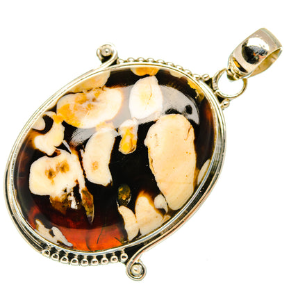 Oval sterling silver pendant with black-and-cream jasper pattern and small bail