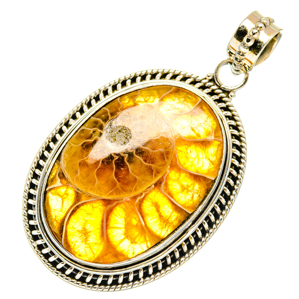 Oval amber fossil pendant in ornate sterling-silver frame with bail